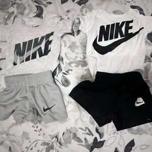 2 newborn Nike sets